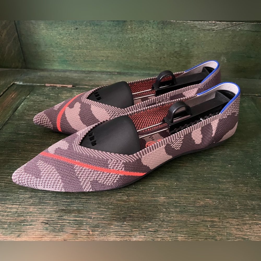 Rothy’s Desert Camo Points with orange stripes.